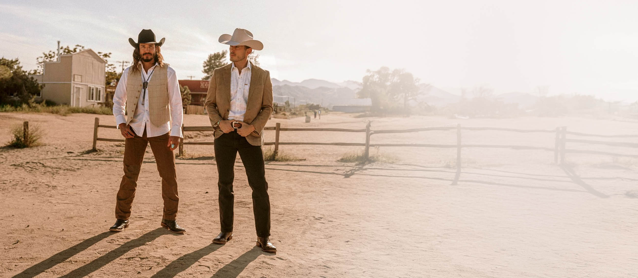 Two men wearing El Paso styles in the desert.